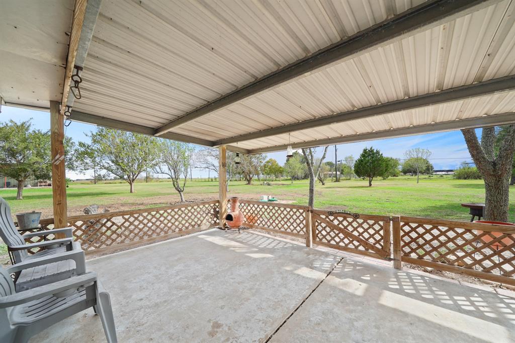 Large fenced covered patio space to enjoy the backyard