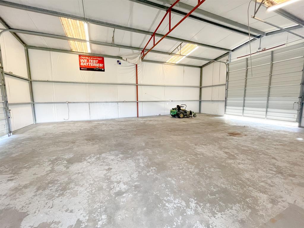 1,200 sqft of enclosed space with commercial sized doors at the front and back of building