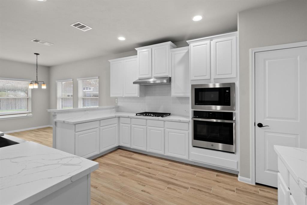 Kitchen featuring new cabinets, countertops and stainless steel appliances