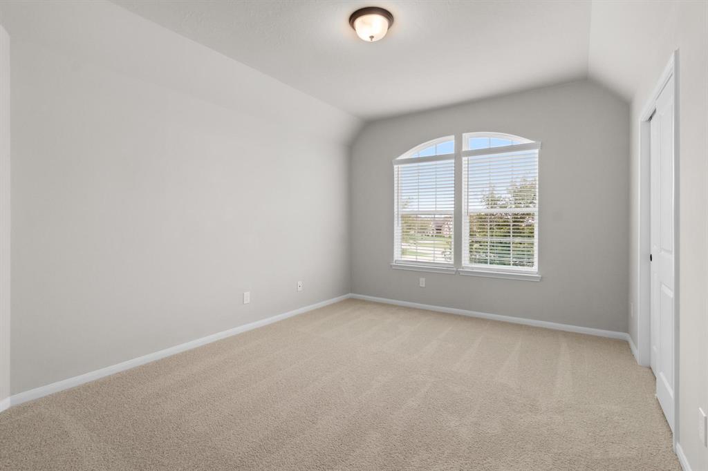 Bedroom 1 upstairs with sloped ceilings