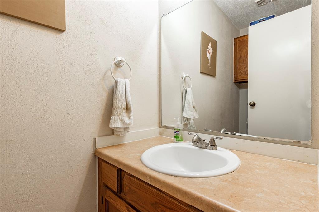 The powder room is conveniently located downstairs for guest.