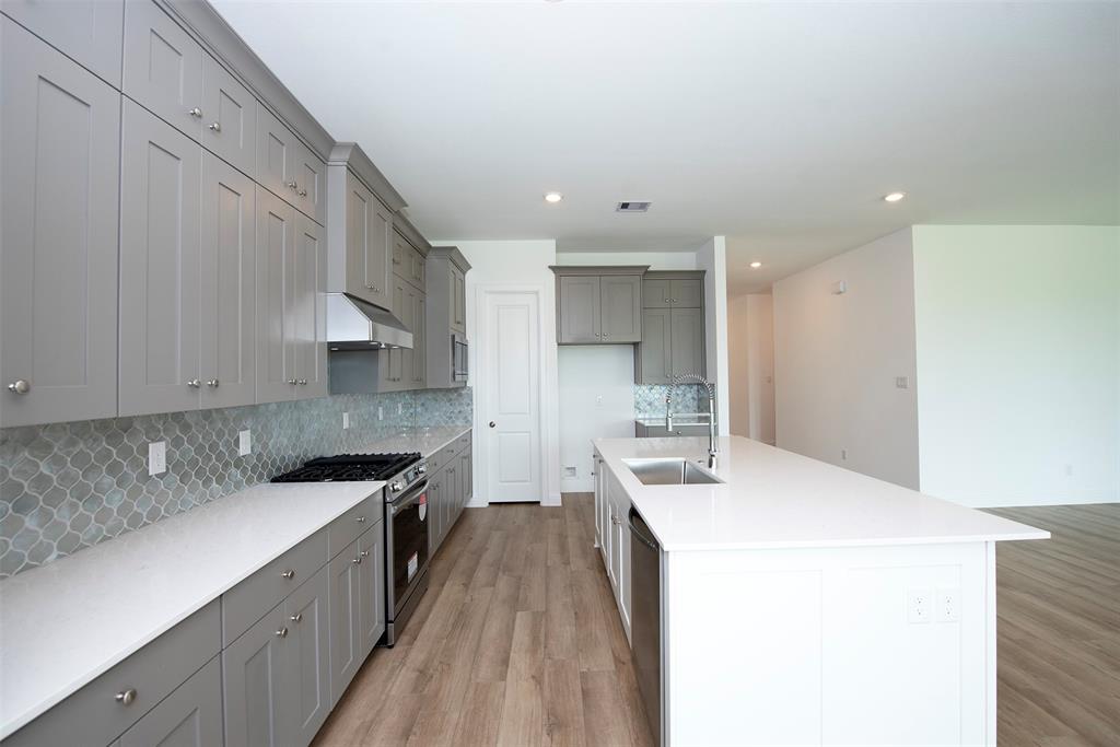 The kitchen and the gorgeous quartz countertops will easily accommodate more than one chef.