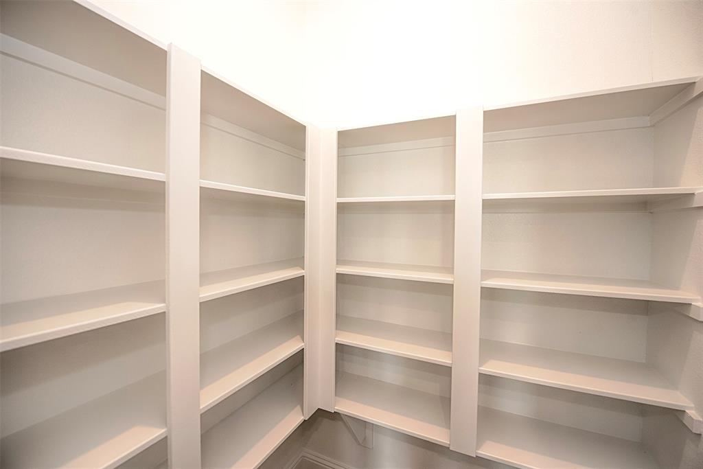 There is also an amazing walk in pantry with two walls of 5 levels of shelving.