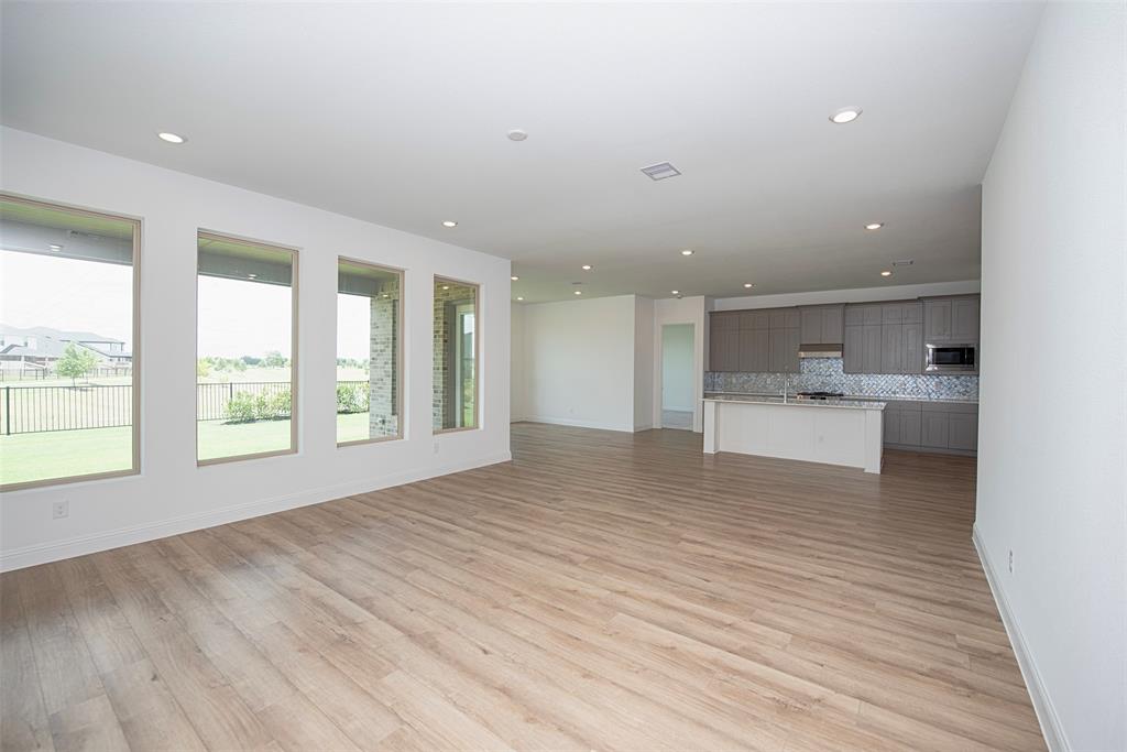 Another view of the large family room showing the fabulous views of the backyard and lake.