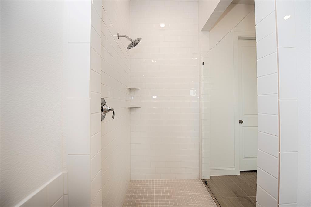 Large alk in shower with built in niches for your bathing essentials.