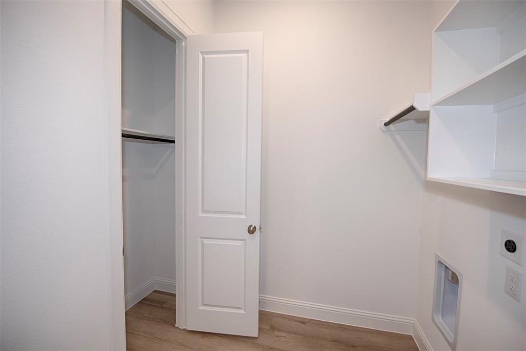 Utility room even provides a closet! The perfect spot for storing home cleaning items. Even space for a vacuum.