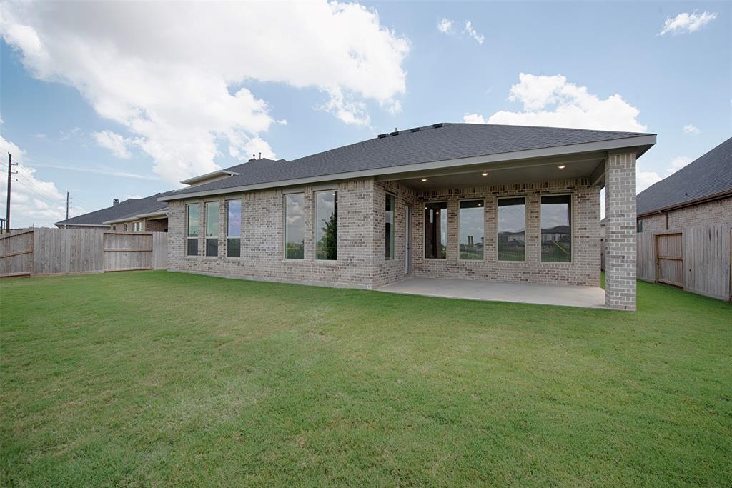 Another view of the backyard to the home showing the amazing patio. Imagine the great BBQ parties with friends and family.