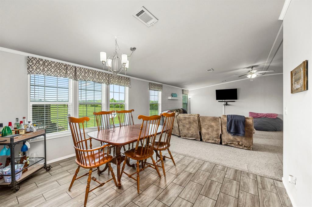 Dining room is just off the kitchen which makes getting that second plate of Thanksgiving dinner easy!Down the hall is the 3rd full bath and 4th bedroom and utility room.