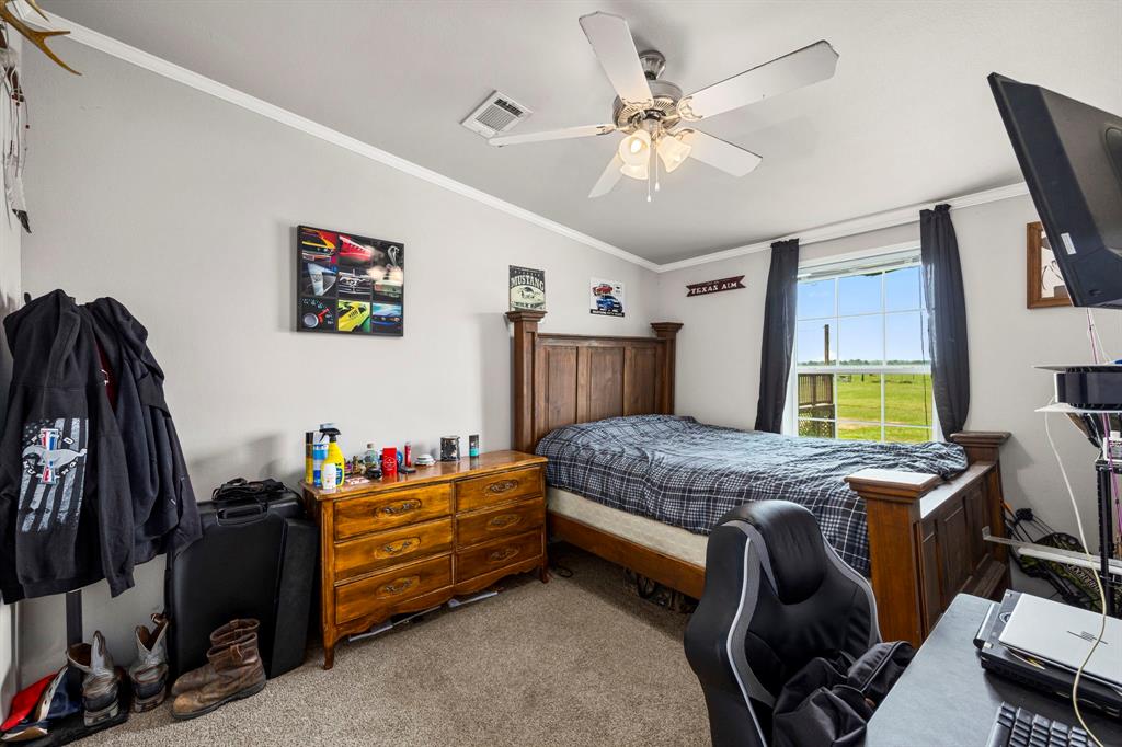 Utility room with side access from the gravel driveway. This utility room has tons of space and the custom built in landing area is the perfect place to toss your backpacks, jackets and hats before entering the home.