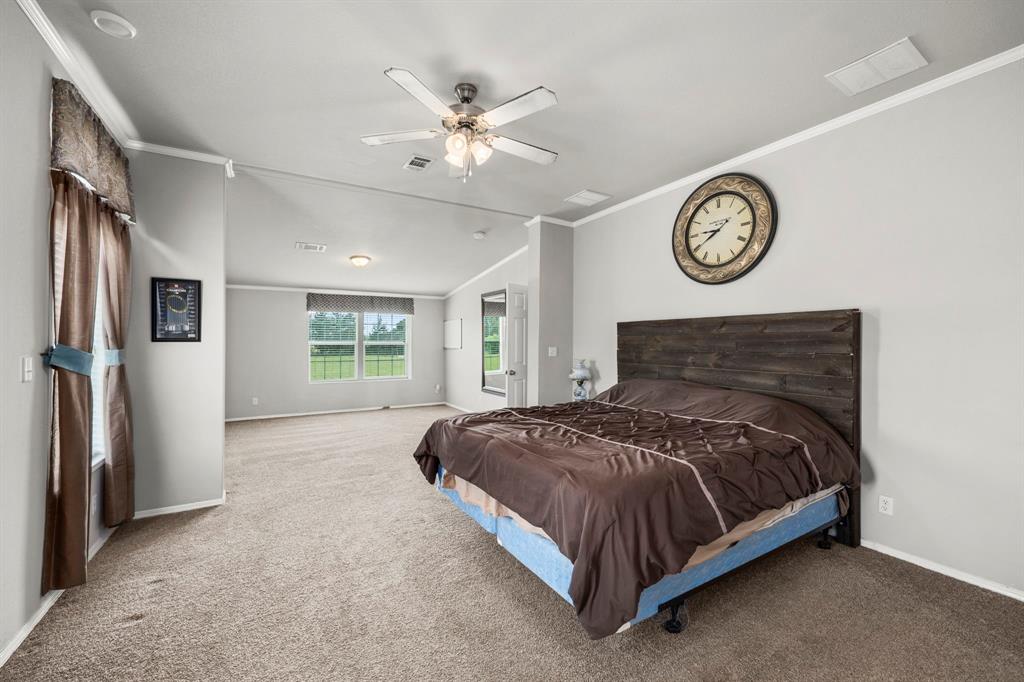 Primary on suite bathroom is spacious with a relaxing soaking tub just under a window complete with a separate glass shower and dual sinks