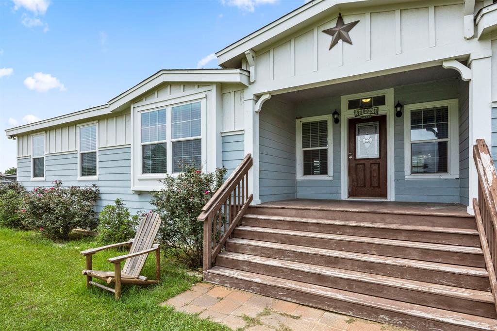 Upon entry from the covered front porch you are immediately greeted by a large and open entry into the living room with lots of natural light