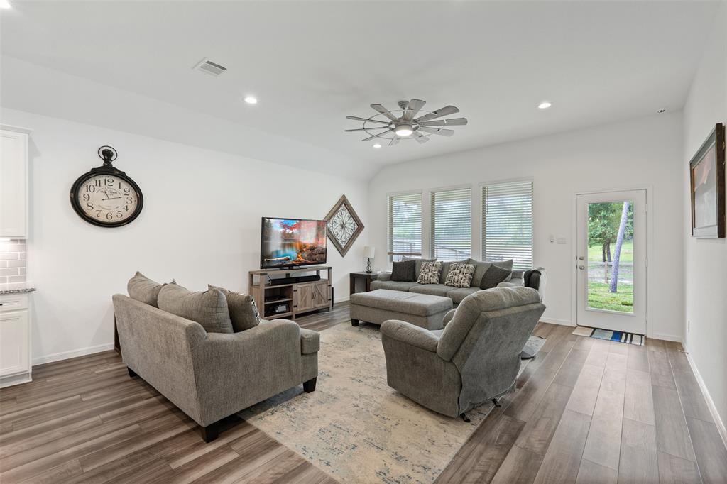 Living Room is open to the kitchen and overlooks the back yard