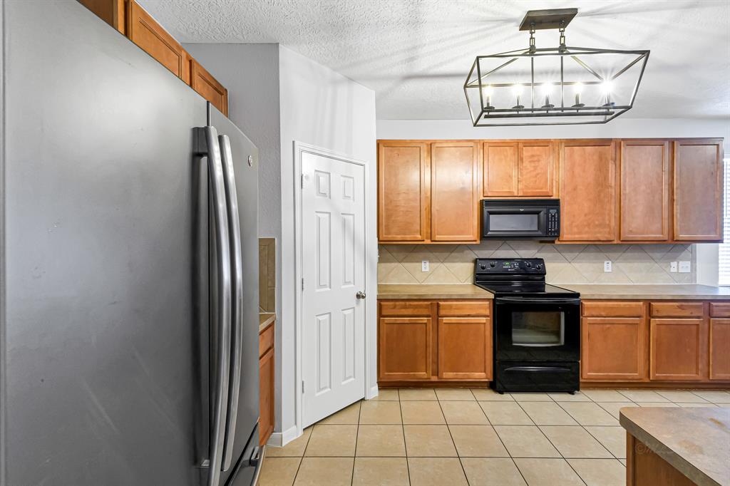 Kitchen has updated hanging lights