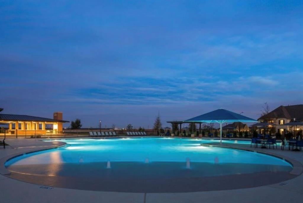 Large, covered Patio with Automatic Sprinkler system.