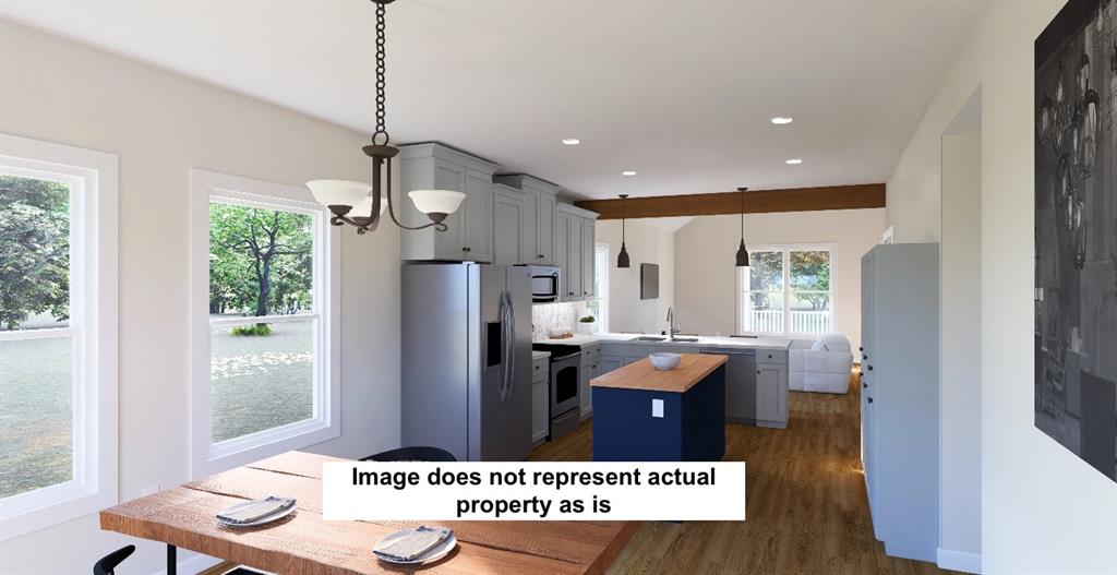 Kitchen dining open to living. Picture for reference of layout, will be similar colors/finishes subject to change based on availability/builder. Image is virtually staged