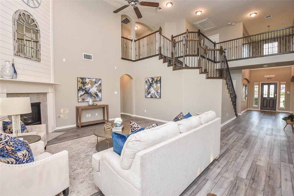 What a truly divine look at the sophisticated formal dining area; off the wide main hallway, (a teasing view upstairs), and straight ahead into your spectacular living/family area.