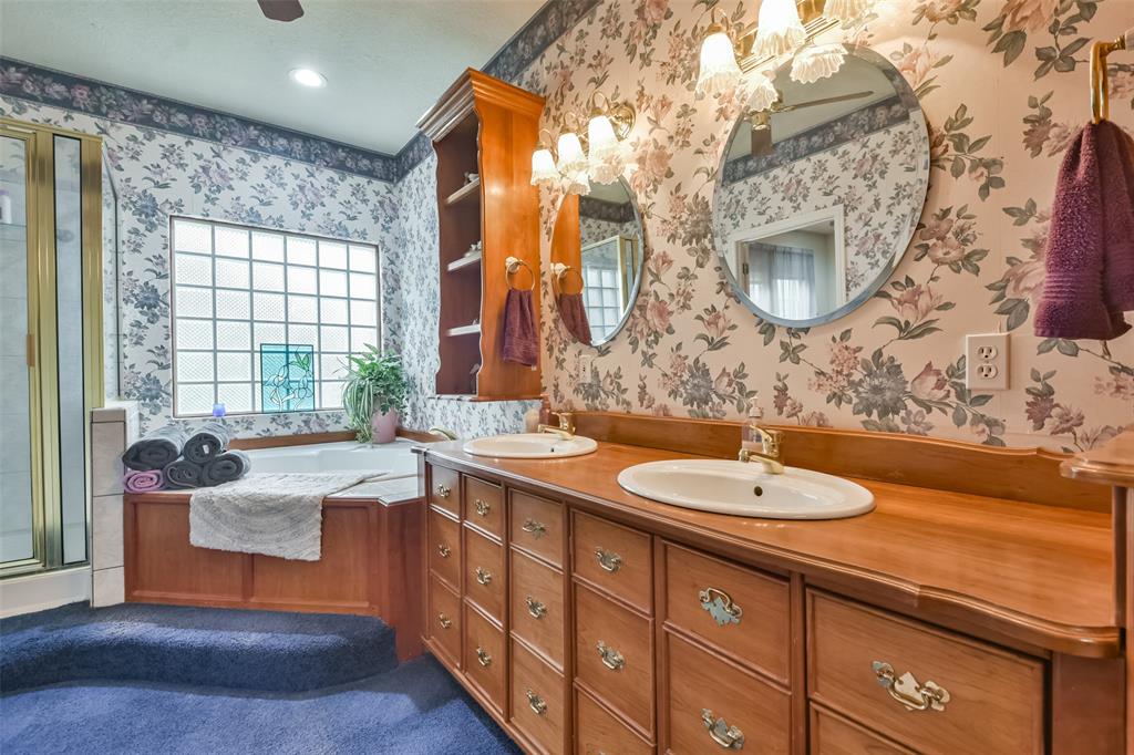 Primary ensuite bathroom with solid cherry hardwood cabinets.