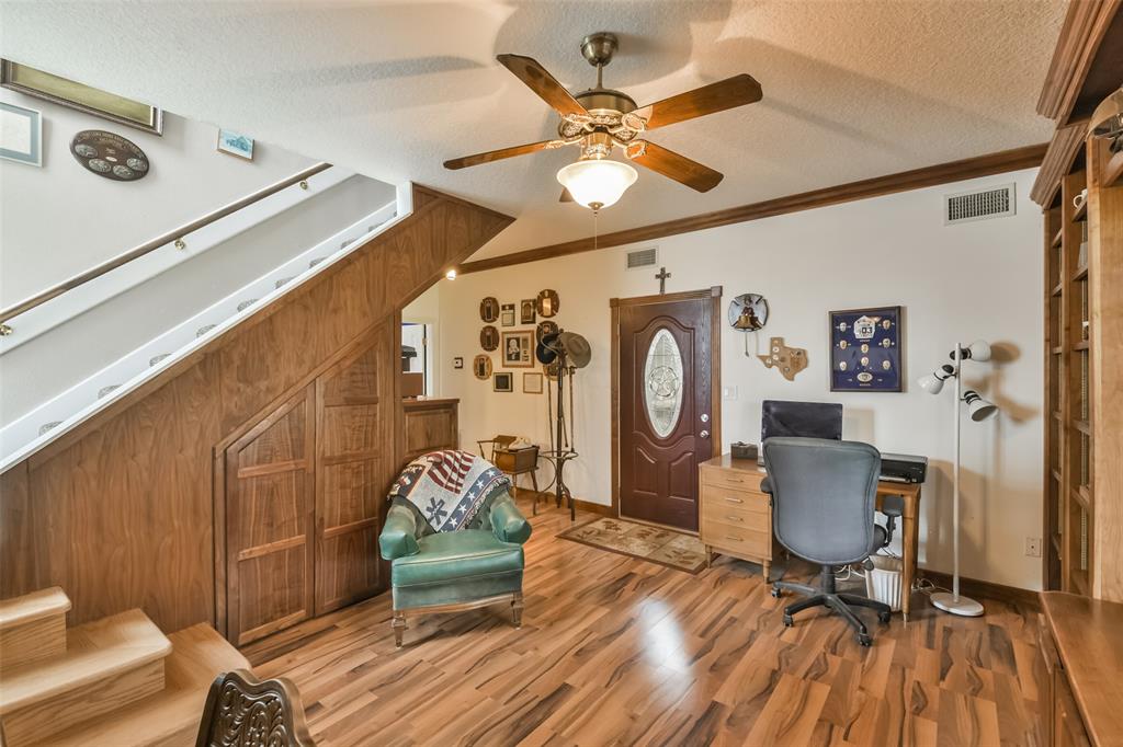 Stairs leading up to main living area and door leading to shop