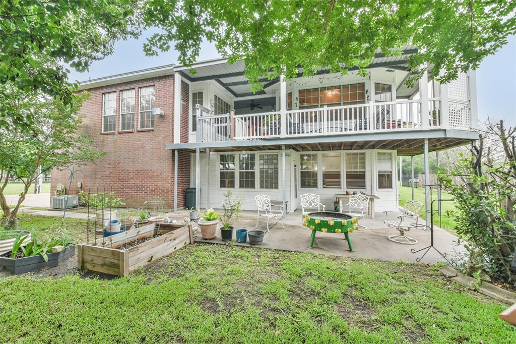 View of back of home - look at those porches!