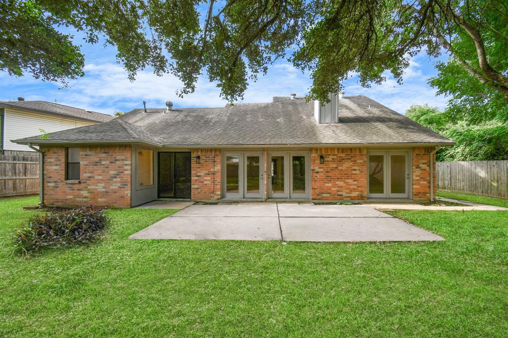 Extended patio with beautiful French doors , perfect for entertaining and BBQ nights