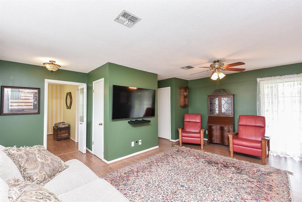 This cozy and inviting living area with large windows that fill the space with natural light.