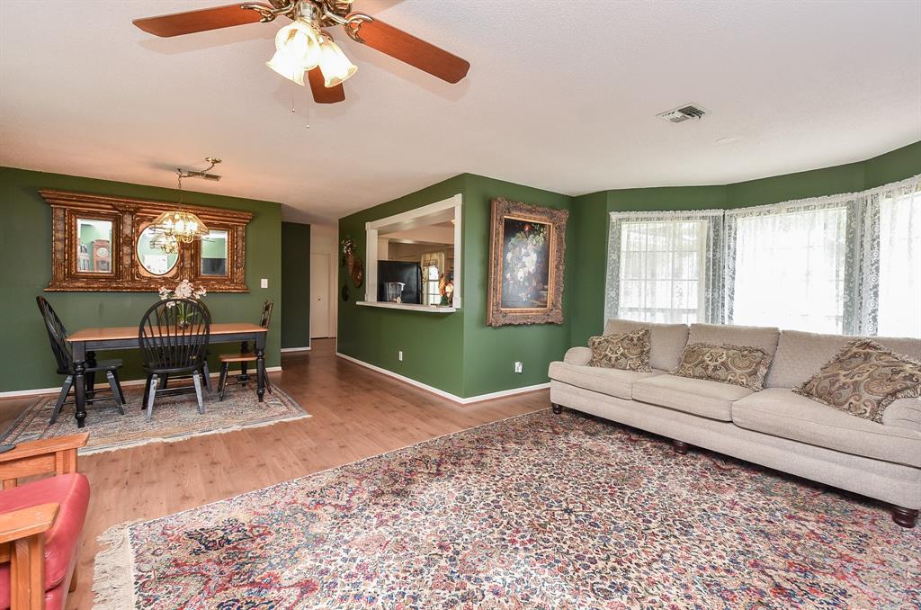 The dining room is  situated adjacent to the living room.