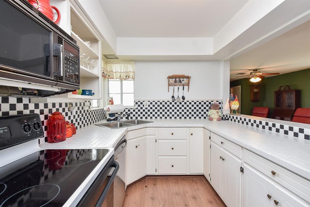 This light and bright kitchen offers plenty of meal prep counter space.