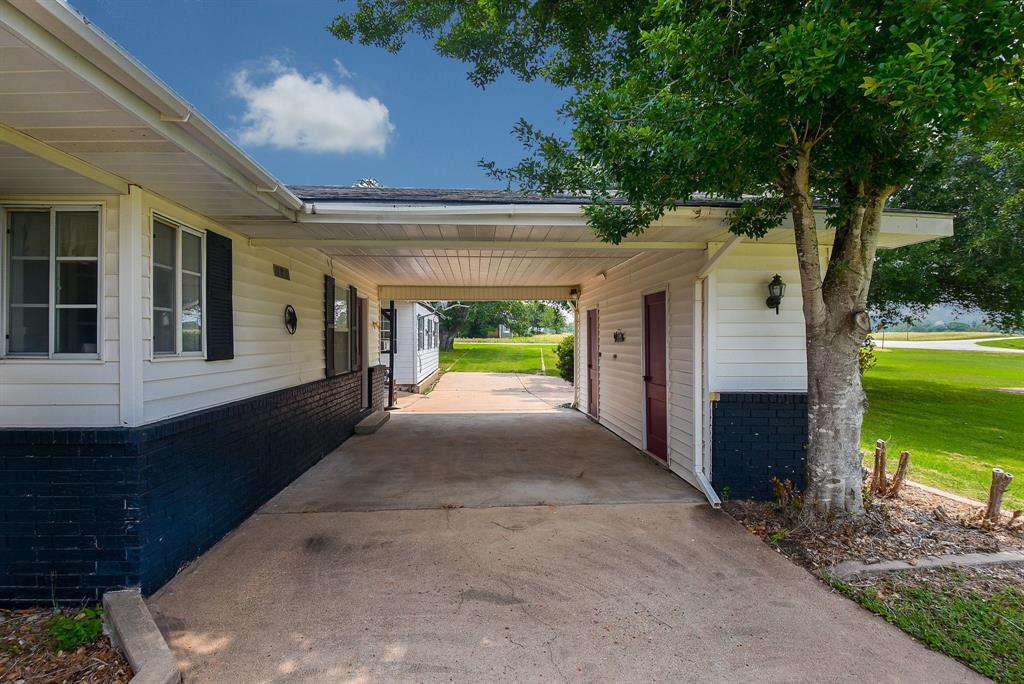 A convenient drive-through carport keeps you dry on those rainy days.