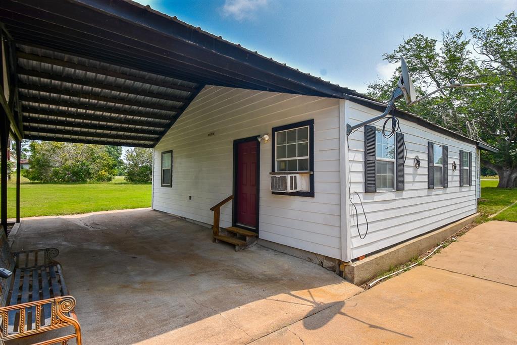 This is another carport between the house and the garage. The garage also has a little office and bathroom.