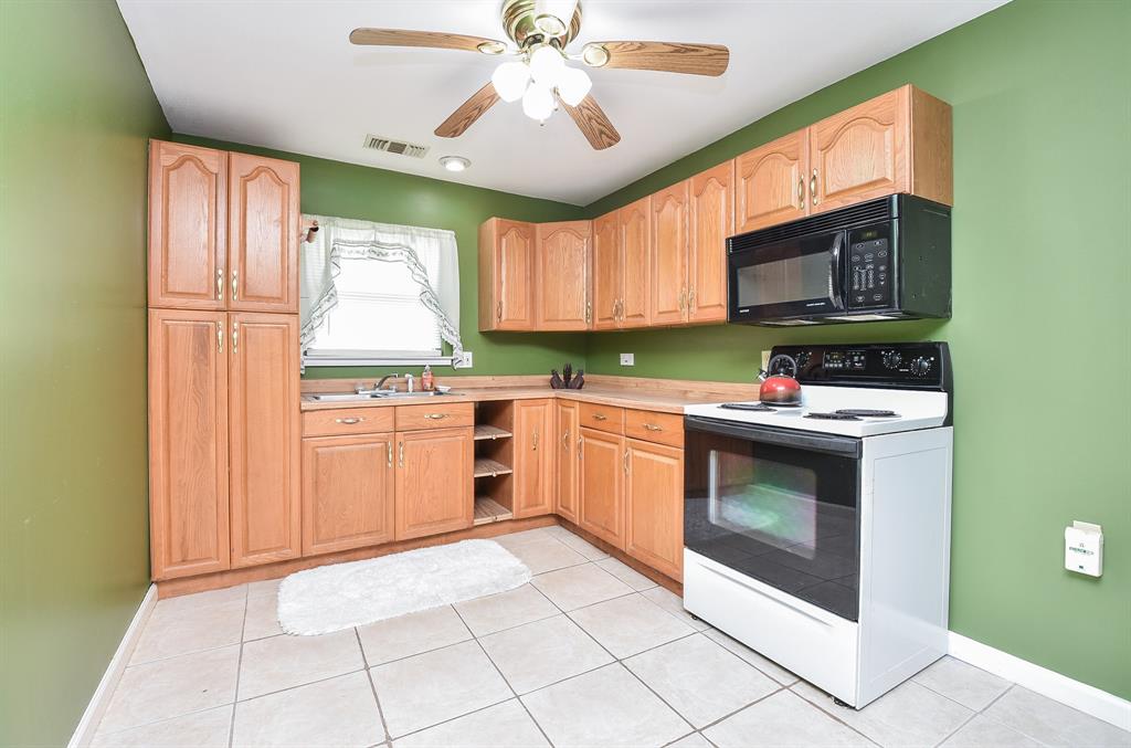 The kitchen offers plenty of storage.