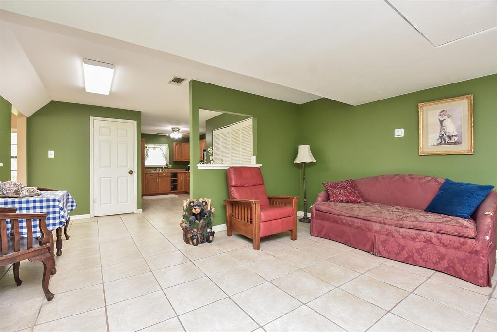 Another great photo of the flex/dining/kitchen area.  The door is where the bathroom is located.