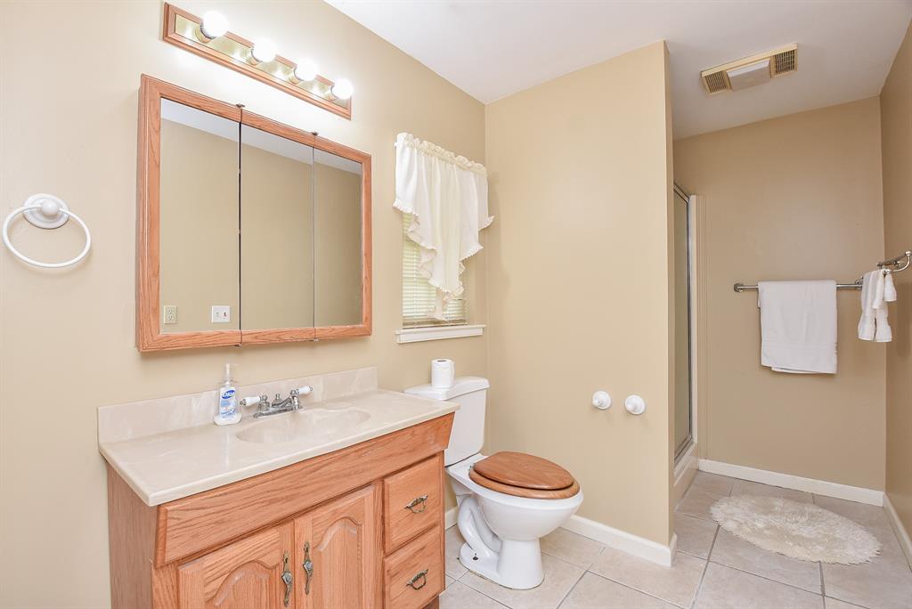 Very nice size bathroom with a stand alone shower.