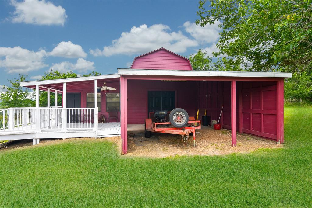 There is a carport and those double doors open into the flex area.