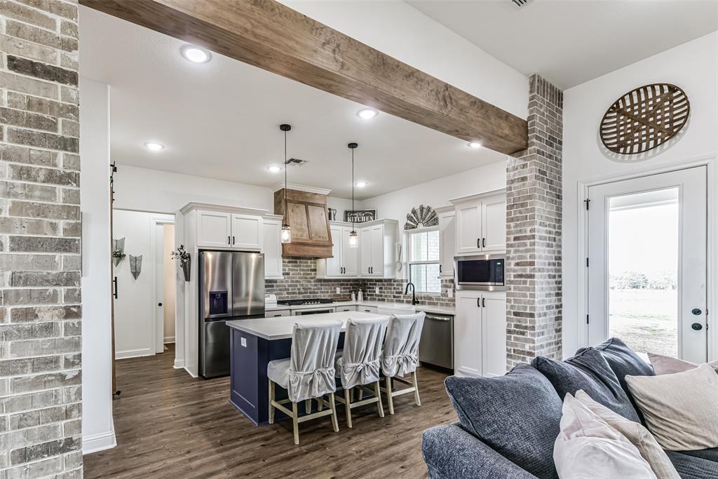 The wood beams and exposed brick are stunning.