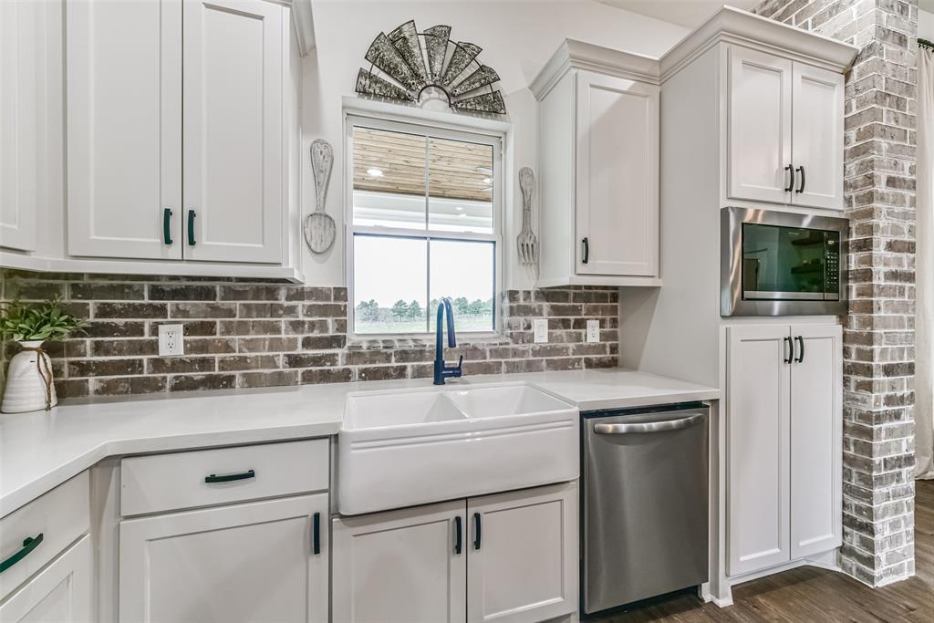 Daydream while doing dishes in your farm sink, overlooking your enormous back yard.