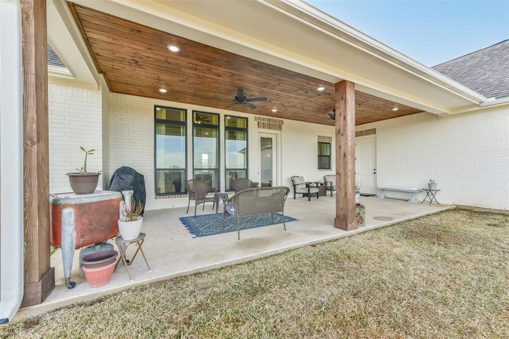 The back porch has sollid pine ceiling, recessed lighting and ceiling fans.