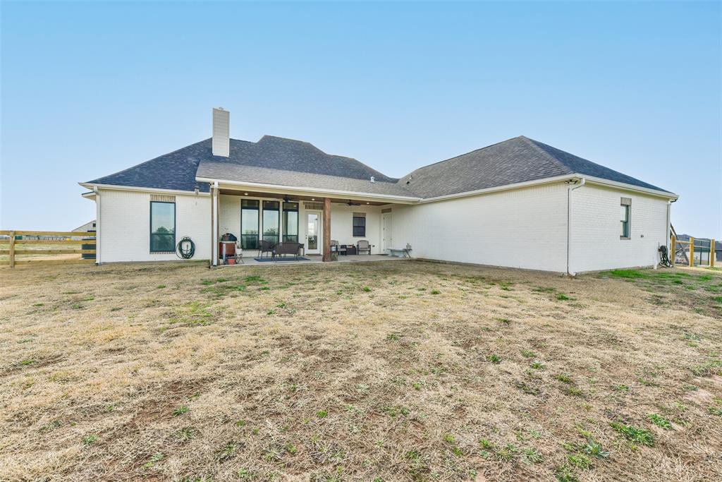 All sides of this home have brick and full gutters.