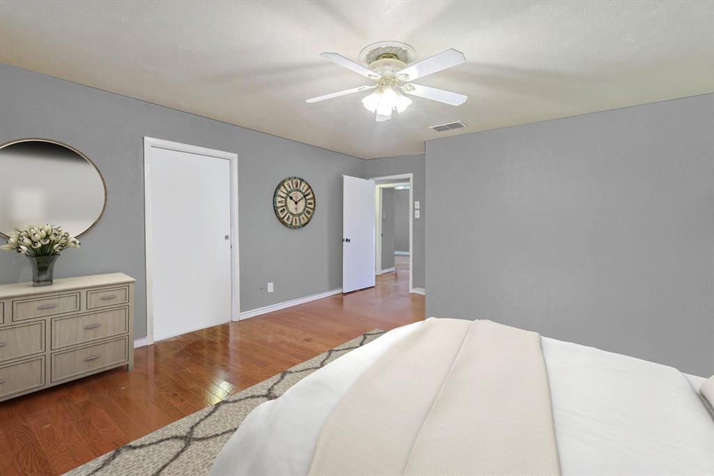 Primary bedroom, has built in hid away ironing board.