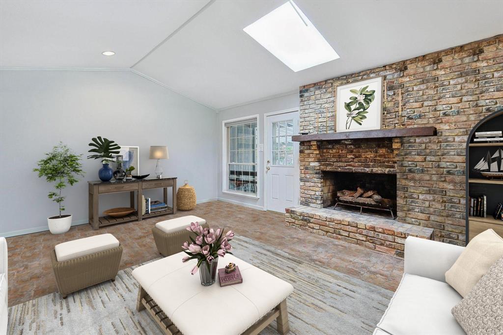 Living room is centrally located. Notice the unique brick flooring and amazing fireplace.