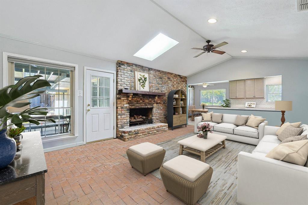 Living room is large and offers a vaulted ceiling with remote controlled skylight which can be vented for energy efficiency and ceiling fan.