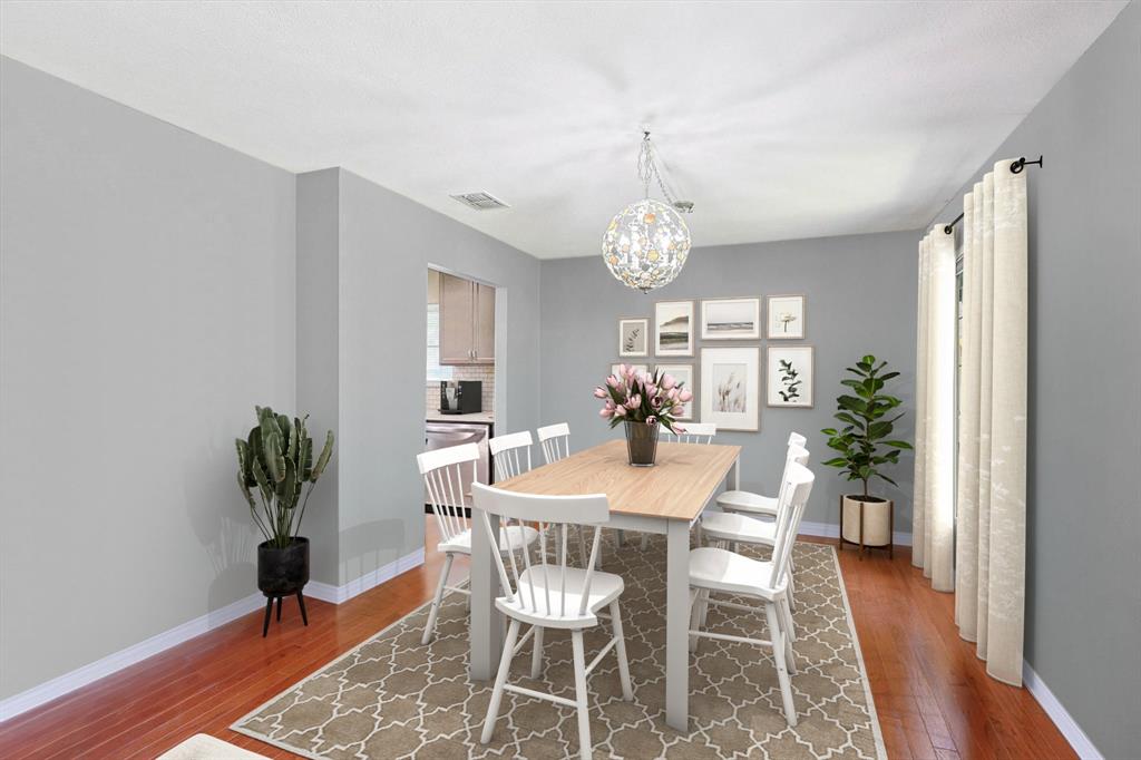 Formal dining area allows space for flexible sitting arrangements. Shown with sitting for eight.