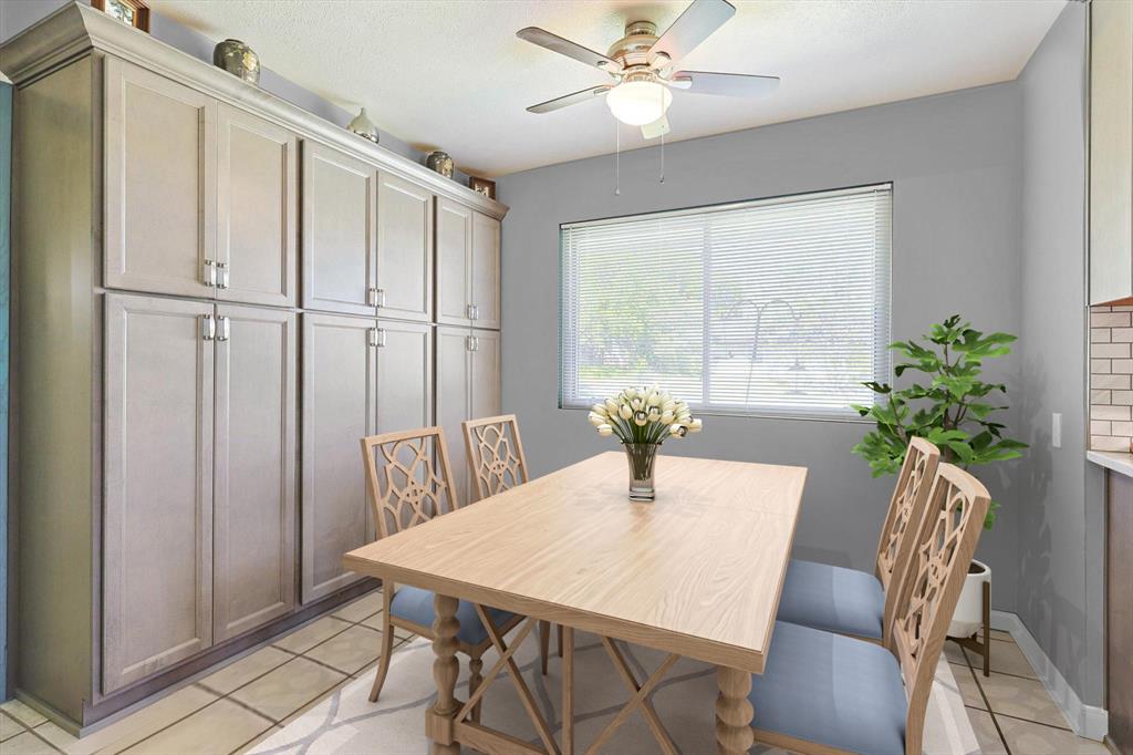 Tiled eat in dining space featuring additional custom built ins for additional pantry space and perfect for all those large counter top appliances.