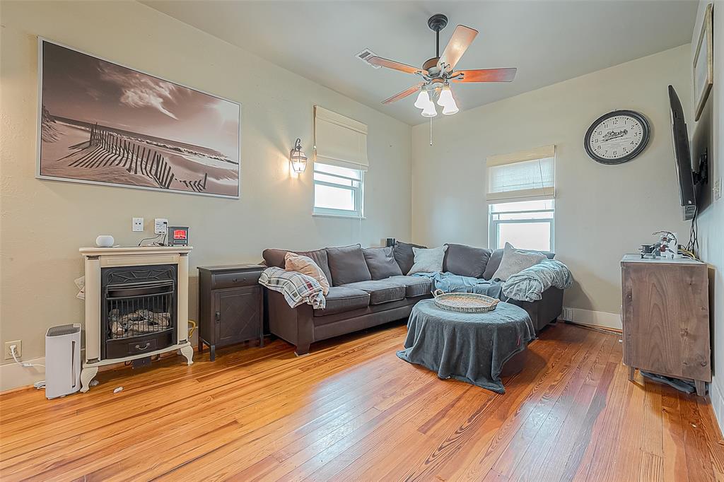 This view of the living area shows the vintage gas heater.