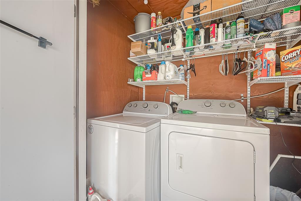 Conveniently located on the downstair patio, this shared laundry facility ensures easy access for both units while maintaining privacy  within the duplex.