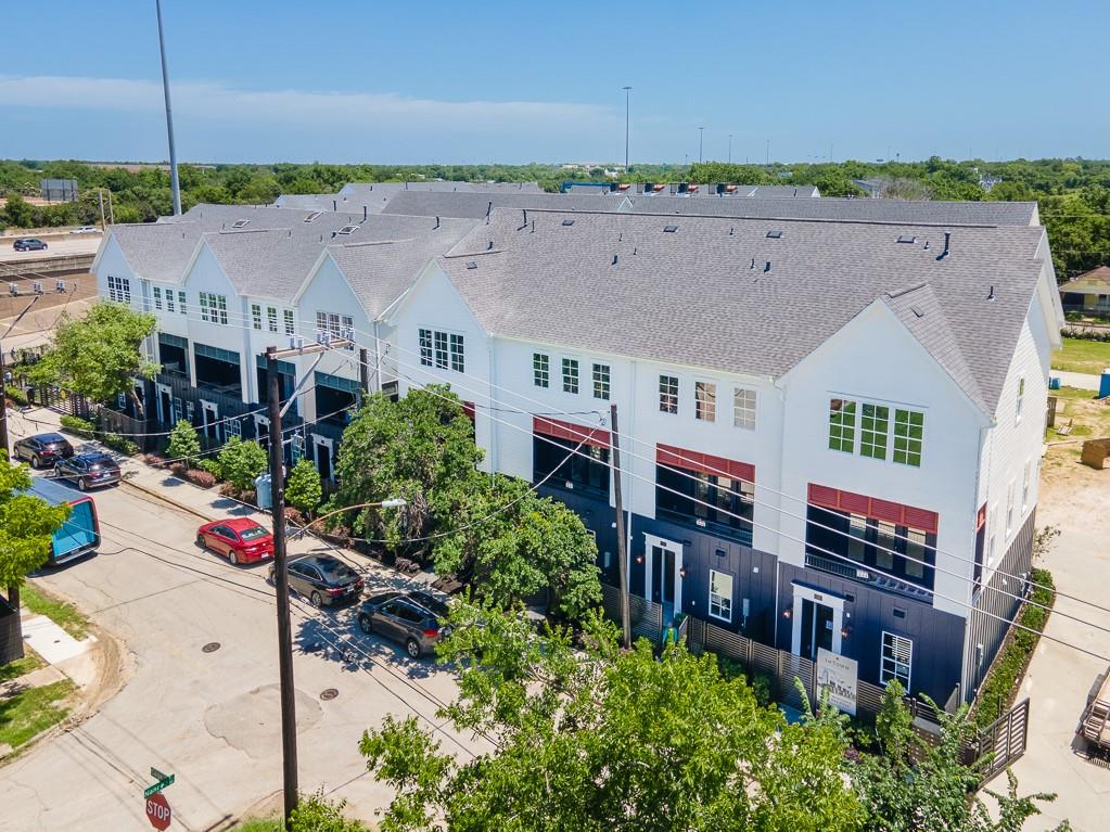 Streetscape, end unit on far right with windows running down the side.