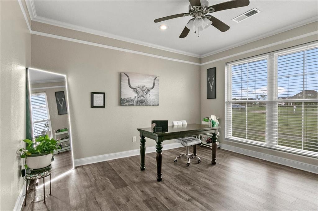 The formal dining room is being used currently as an office.