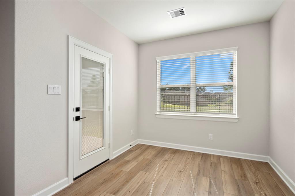 The dining area is a cozy nook adjacent to the kitchen, featuring lots of natural light.