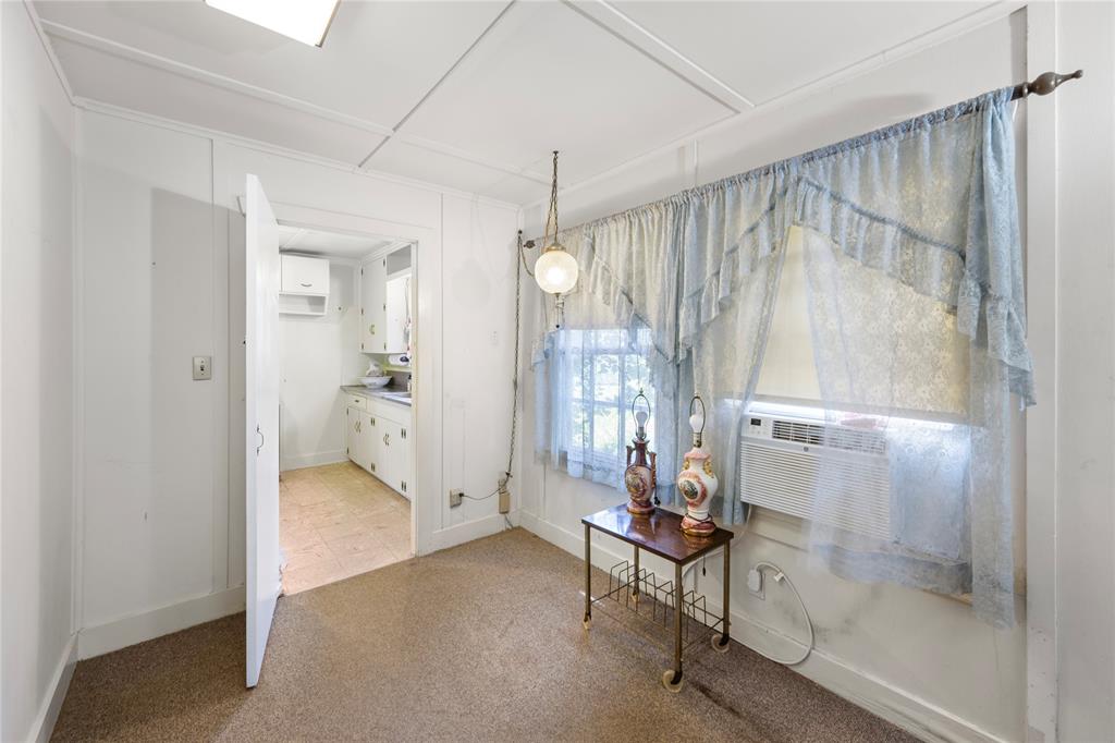 View of dining area and entrance to kitchen.