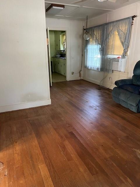 View of living room/dining area as you enter from the front door. Lovely hardwood floors are original to home.