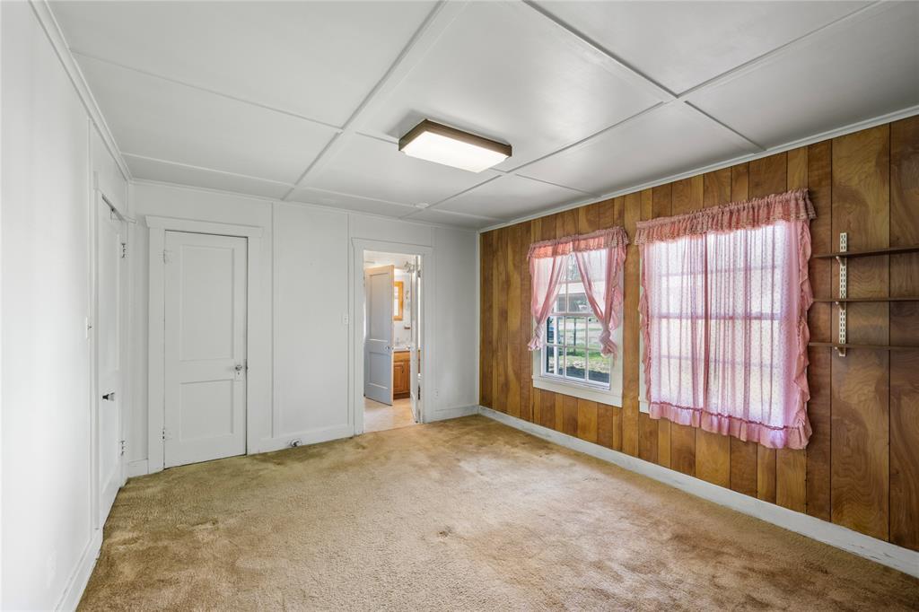 This is one of two bedrooms with 3-piece bath located in between.  This room has two closets and access to back porch.